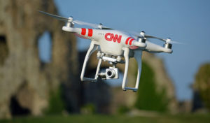 CNN won permission from the U.S. aviation administration to allow dro<em></em>nes to fly over the crowd